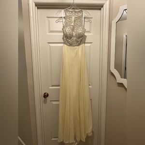 Never worn! Beautiful soft yellow, mesh top with beading.